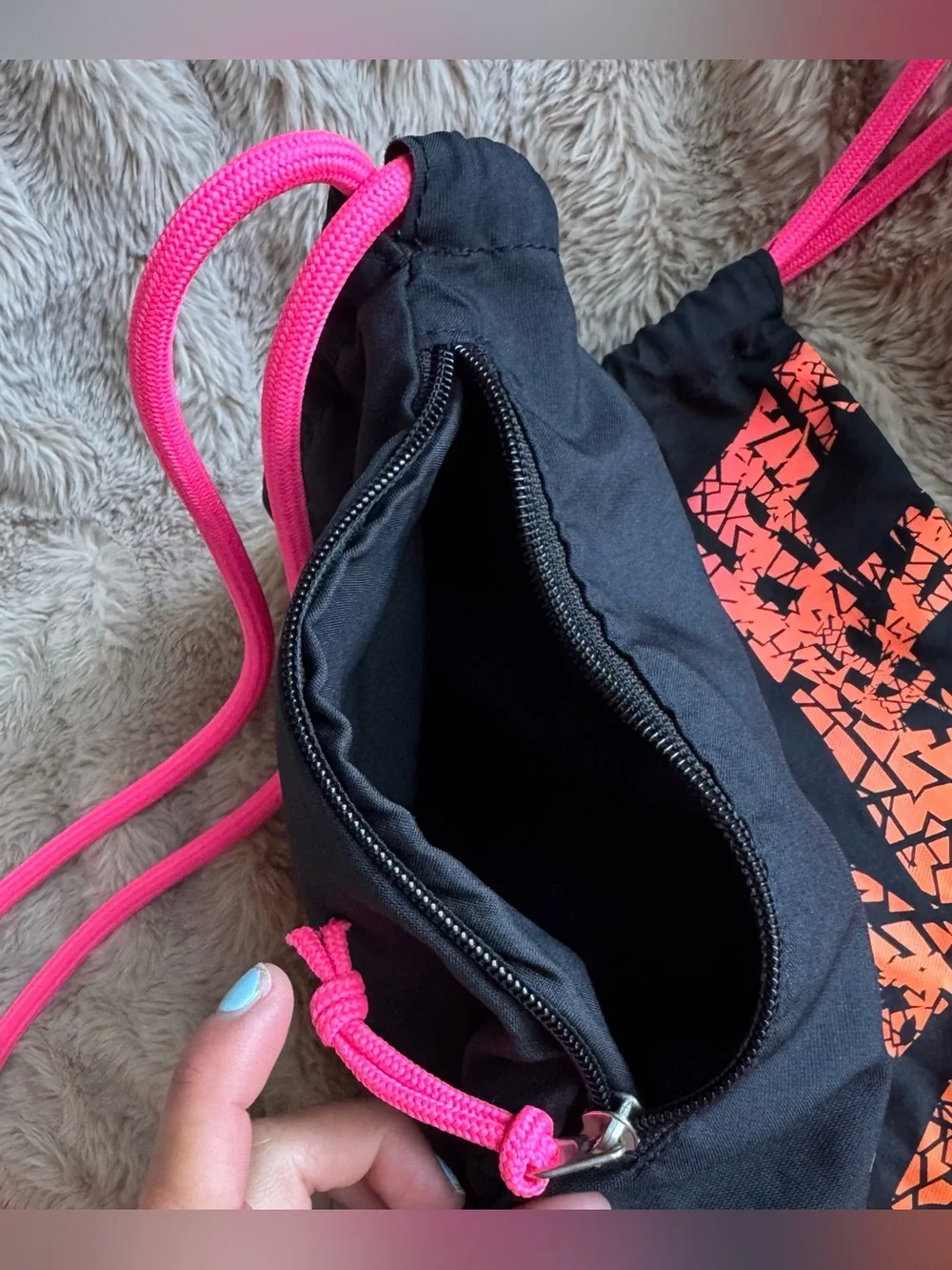 Nike Black Drawstring Backpack with Pink-to-Orange Gradient Logo